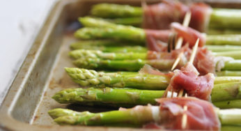 Green asparagus in pieces of glass